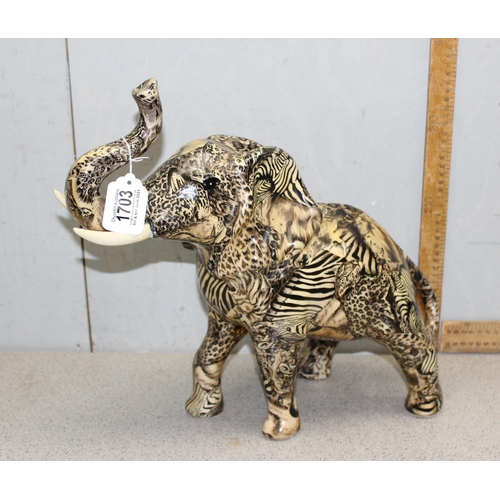 1703 - Pottery elephant with African animal pattern design