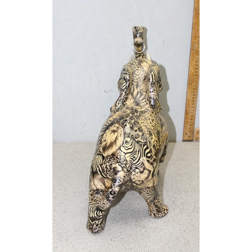 1703 - Pottery elephant with African animal pattern design