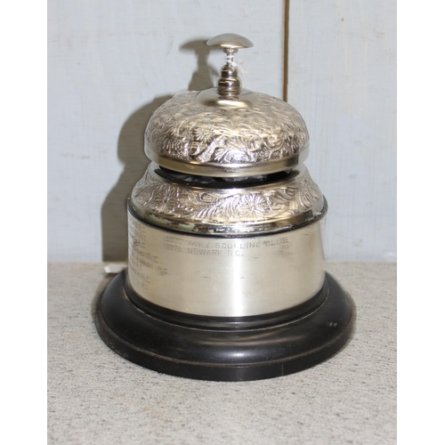 1709 - Cast iron Napoleon doorstop, mounted shop bell & a boxed pair of reproduction plaques