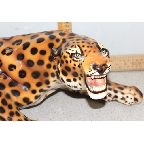 1710 - Large pottery figure of a Leopard seemingly unmarked, measures approx 75cm from tail to paw