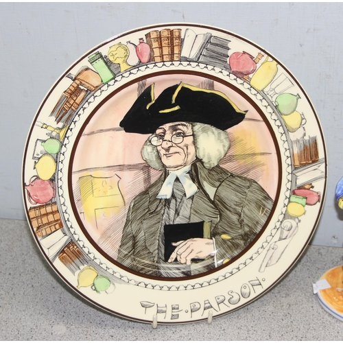 1724 - A pair of Royal Doulton series ware plates and a pair of Spanish faience style figures of soldiers, ... 