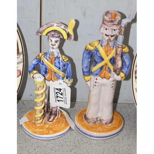 1724 - A pair of Royal Doulton series ware plates and a pair of Spanish faience style figures of soldiers, ... 