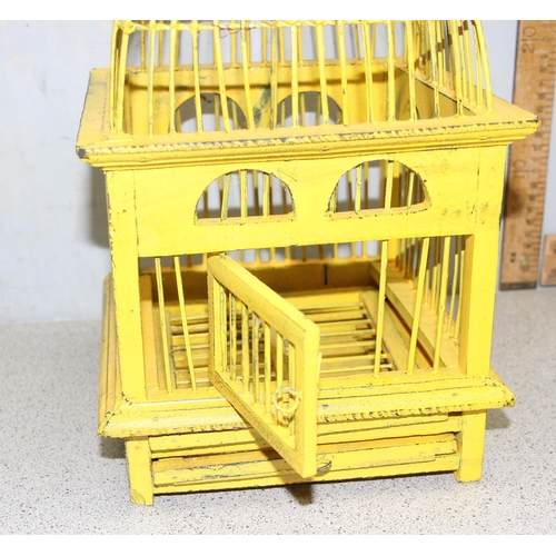 280 - A vintage yellow painted wooden display birdcage, approx 46cm tall