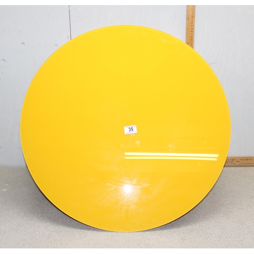 35 - An Italian designed wall cabinet by Lago, of circular form in yellow, approx 68cm in diameter