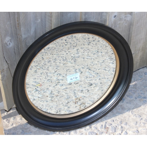 414 - A large oak framed hall mirror and a small round framed mirror