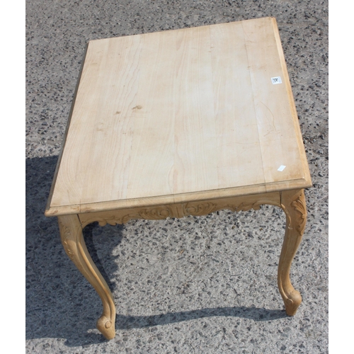 148 - Pine coffee table with carved details, approx 91cm wide