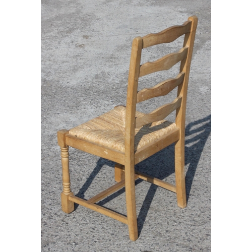 150 - 4 pine ladderback kitchen chairs with rush seats