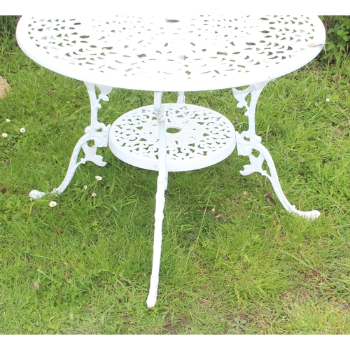 318 - A Victorian style white painted aluminium garden table, approx 87cm in diameter