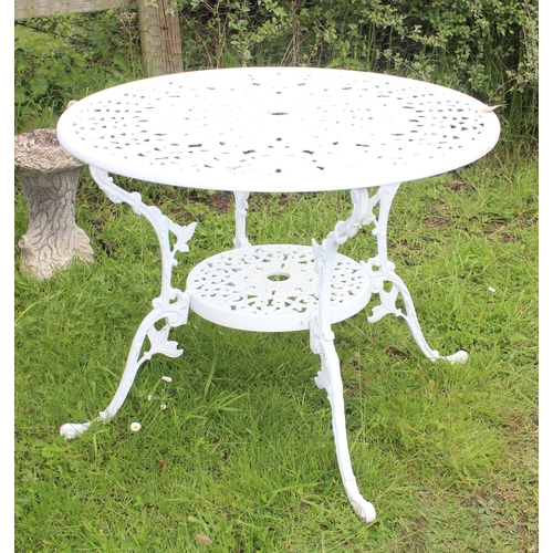 318 - A Victorian style white painted aluminium garden table, approx 87cm in diameter