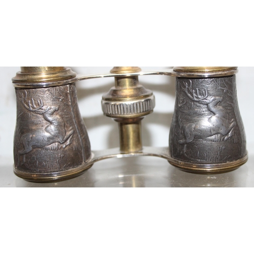 1640 - A pair of vintage opera glasses with stag hunting motifs, a glass handled magnifying glass, a pair o... 