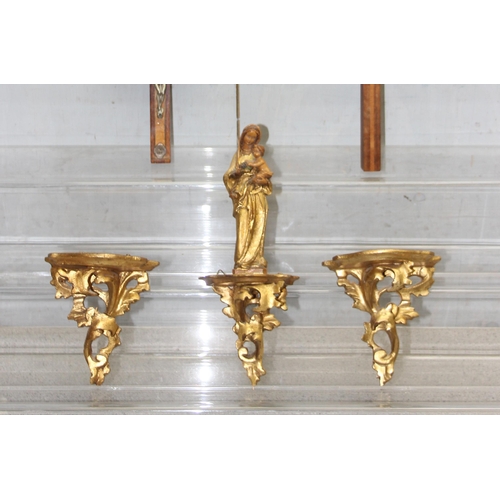 1797 - A pair of small Italian carved giltwood wall brackets, a similar bracket with a Madonna and Child an... 