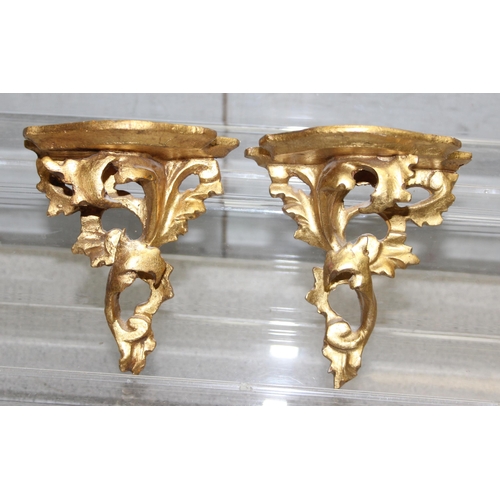 1797 - A pair of small Italian carved giltwood wall brackets, a similar bracket with a Madonna and Child an... 