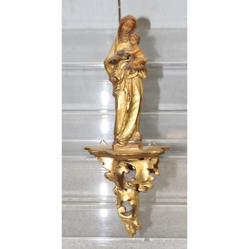 1797 - A pair of small Italian carved giltwood wall brackets, a similar bracket with a Madonna and Child an... 