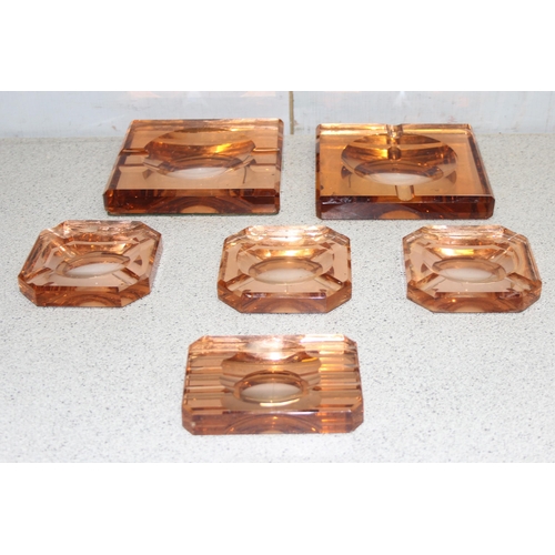 1799 - 6 assorted Art Deco style amber mirrored glass ashtrays, believed to be Belgian, all seemingly unmar... 