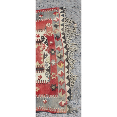 213 - A vintage red ground flatweave Kilim prayer rug, approx 160cm x 100cm