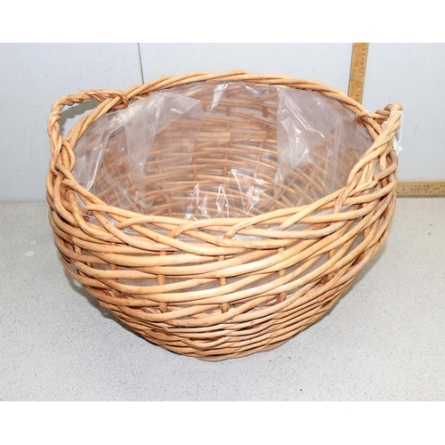 295 - A large wicker log basket, approx 55cm wide