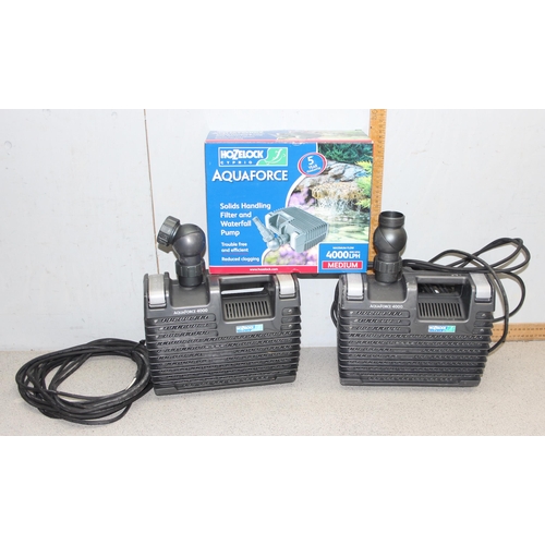 302 - 2 Hozelock Aquaforce 4000 pond pumps, a bag of ceramic filter and a large length of hose, little sig... 