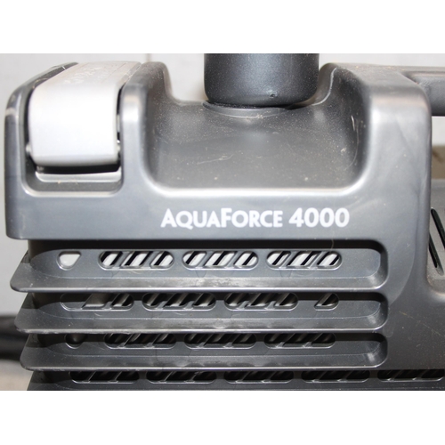 302 - 2 Hozelock Aquaforce 4000 pond pumps, a bag of ceramic filter and a large length of hose, little sig... 