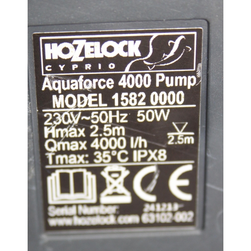 302 - 2 Hozelock Aquaforce 4000 pond pumps, a bag of ceramic filter and a large length of hose, little sig... 