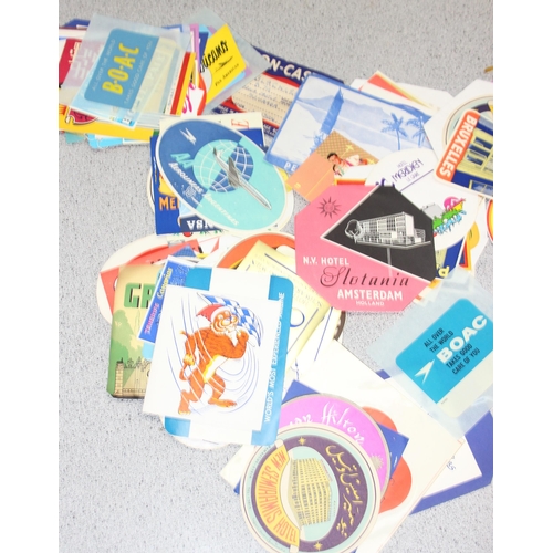 546 - A large qty of assorted vintage luggage labels and airline flight labels etc