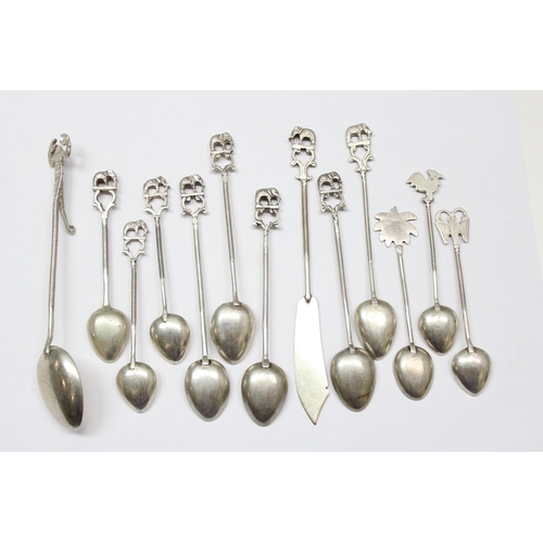 1055 - Qty of unmarked silver spoons and a silver butter knife, all XFR approx 80% pure, some with Elephant... 