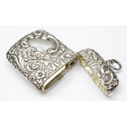 1056 - A silver plated and embossed vesta case and a silver plated Thomas Evans of Treherbert snuff box nam... 