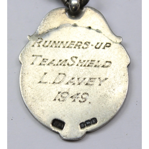 1057 - A silver Albert chain, approx 39cm long with enamel darts fob, approx 41.79g gross