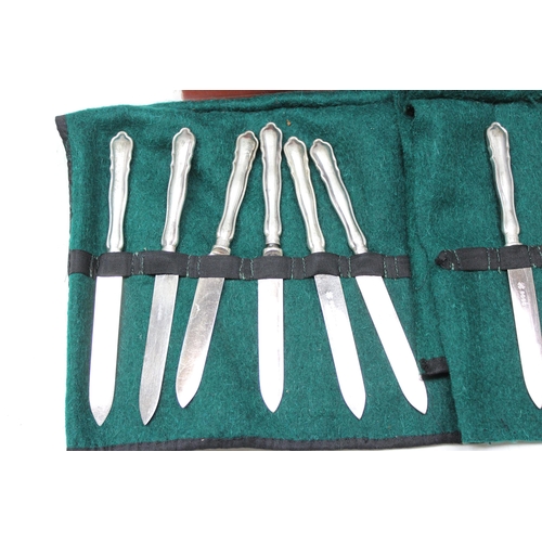 1079 - A set of 12 silver handled knives and a silver handled cake slice