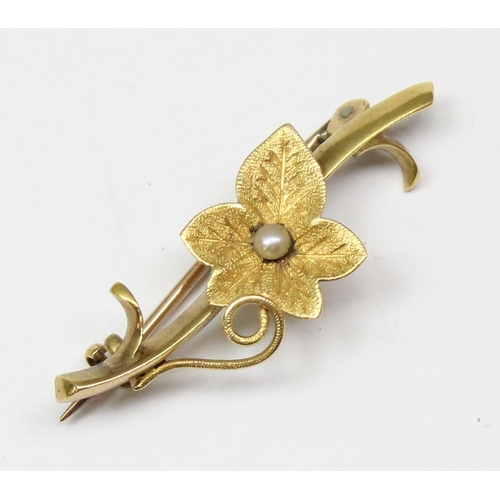 1143 - A 15ct gold brooch formed as a leaf set with seed pearl, approx 2.32g gross