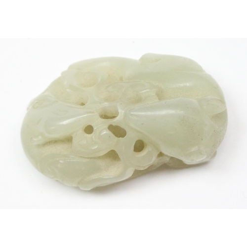 1609 - A small Chinese jade carving depicting 2 entwined mythical beasts, on wooden stand, approx 46mm wide... 