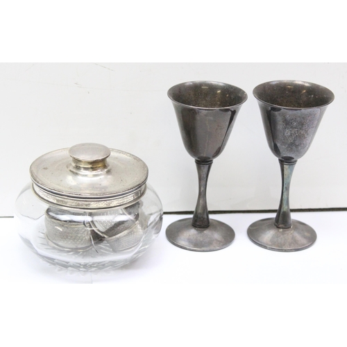 1084 - 3 silver napkin rings, a silver lidded powder jar (af), a silver mounted scent bottle and a pair of ... 