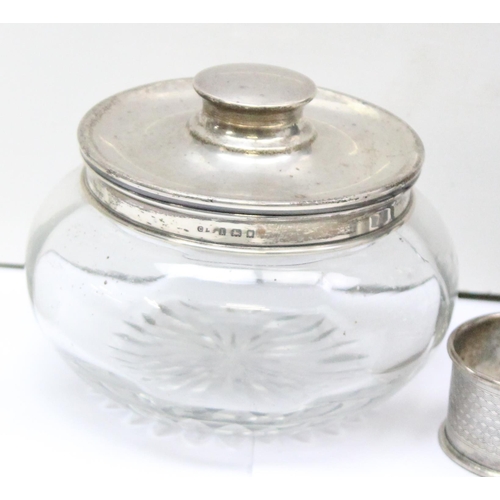 1084 - 3 silver napkin rings, a silver lidded powder jar (af), a silver mounted scent bottle and a pair of ... 