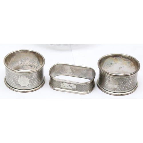 1084 - 3 silver napkin rings, a silver lidded powder jar (af), a silver mounted scent bottle and a pair of ... 