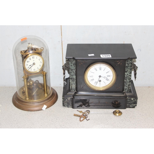 1329 - An antique slate cased mantel clock with key and pendulum and a vintage brass anniversary clock (2)