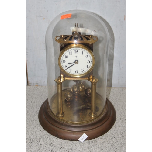 1329 - An antique slate cased mantel clock with key and pendulum and a vintage brass anniversary clock (2)