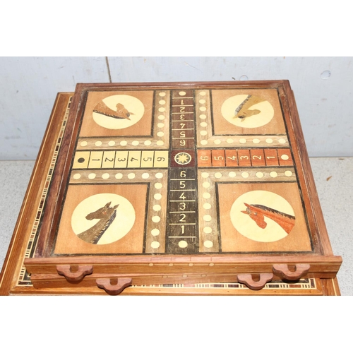 1552 - A highly decorative wooden games compendium with extensive marquetry inlay and a large qty of gaming... 