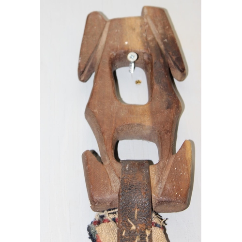 212 - An unusual vintage Qashqai horse or camel strap or band with original wooden winder, approx 640cm lo... 