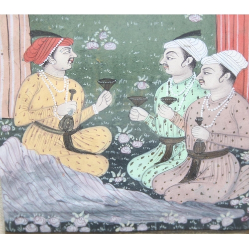 463 - A small Indian Mughal watercolour of seated males drinking, approx 28cm x 20cm inc frame