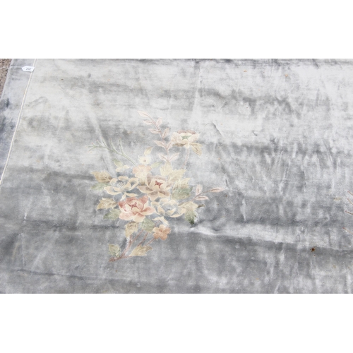 202 - A large silver coloured flower rug, approx 370cm x 276cm