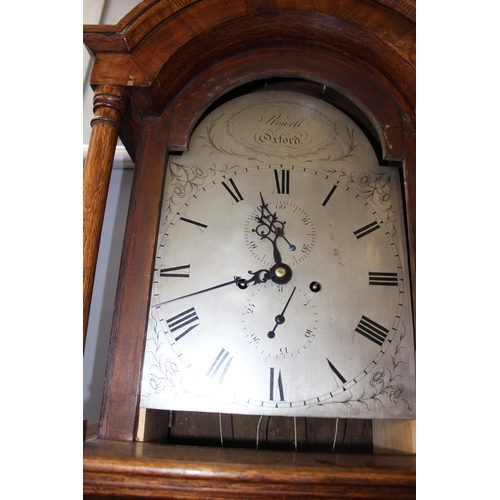 1318A - An early 19th century oak cased 8 day longcase clock by Rowell of Oxford, the silvered dial with 2 s... 