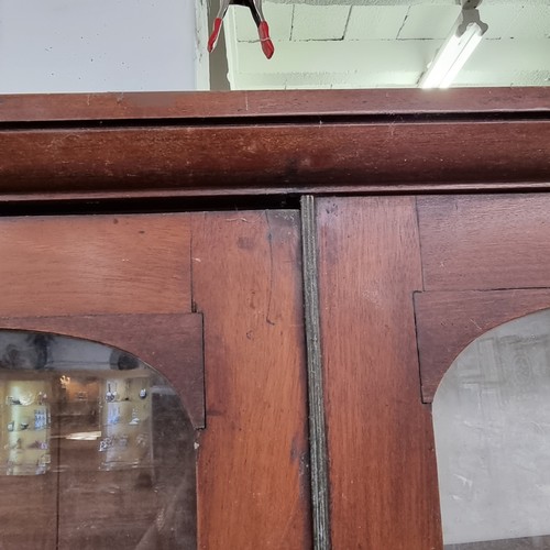 109 - A large 19th century mahogany glazed bookcase with cupboard base, approx 220cm tall x 158cm wide