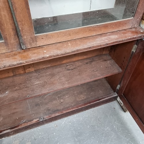 109 - A large 19th century mahogany glazed bookcase with cupboard base, approx 220cm tall x 158cm wide