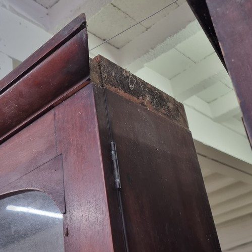 109 - A large 19th century mahogany glazed bookcase with cupboard base, approx 220cm tall x 158cm wide