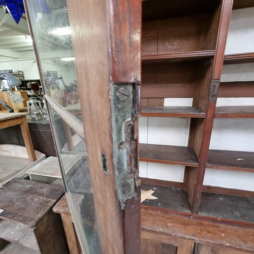 109 - A large 19th century mahogany glazed bookcase with cupboard base, approx 220cm tall x 158cm wide