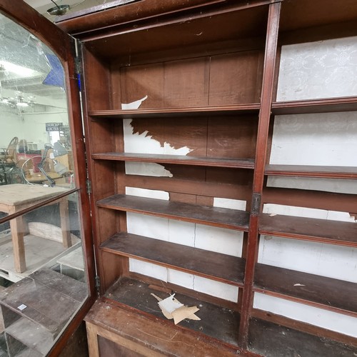 109 - A large 19th century mahogany glazed bookcase with cupboard base, approx 220cm tall x 158cm wide