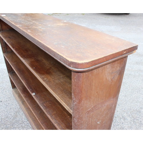 32 - An antique stained pine bookcase with 3 adjustable shelves, approx 160cm wide x 118cm tall x 33cm de... 