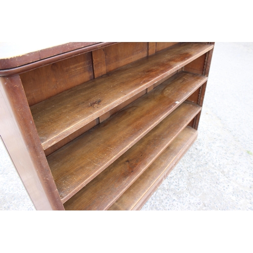 32 - An antique stained pine bookcase with 3 adjustable shelves, approx 160cm wide x 118cm tall x 33cm de... 