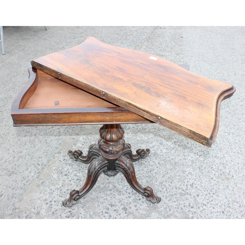 33 - A 19th century rosewood card table with carved base and red gilt tooled leather interior, approx 93c... 