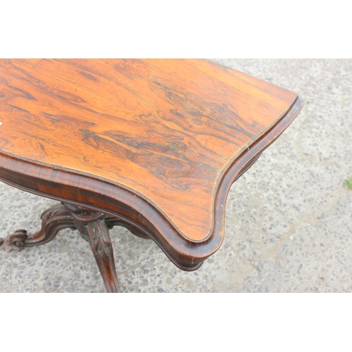 33 - A 19th century rosewood card table with carved base and red gilt tooled leather interior, approx 93c... 