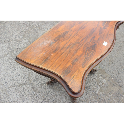 33 - A 19th century rosewood card table with carved base and red gilt tooled leather interior, approx 93c... 